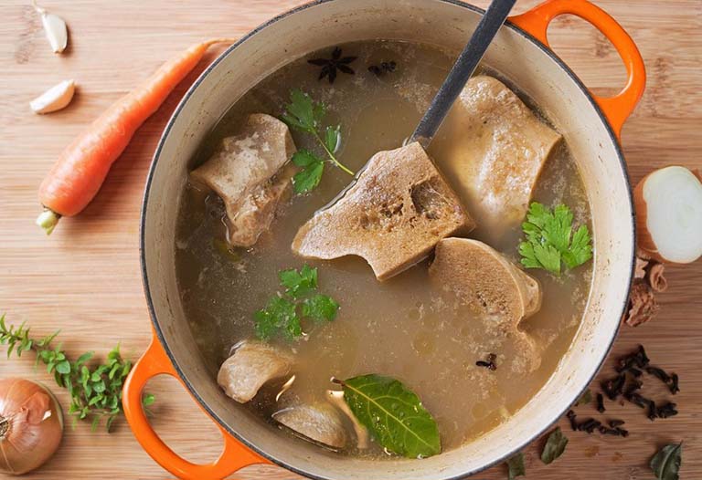 bị gai cột sống có nên uống bổ sung canxi